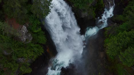 Close-up-cinematic-rising-aerial-shot-of-gushing-Adige-River-waterfall-in-Italy