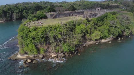 Rotating-aerial-of-prominent-Fort-San-Lorenzo-ruin-in-Colon,-Panama