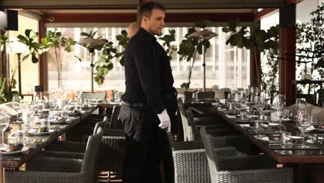 restaurant staff setting a table