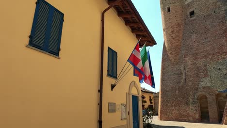 italian and eu flags on a building facade