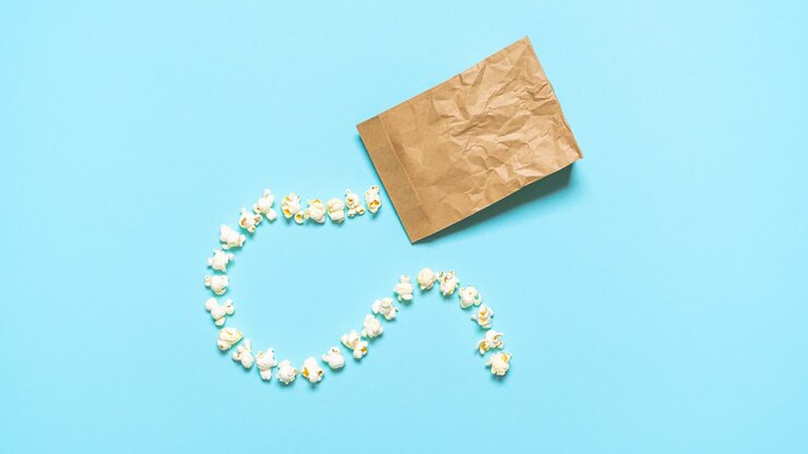 Making popcorn, funny 4K stop motion animation. Flat lay with popping popcorn