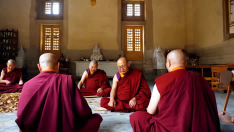 buddhist monks engaging in a sweeping ritual at a temple