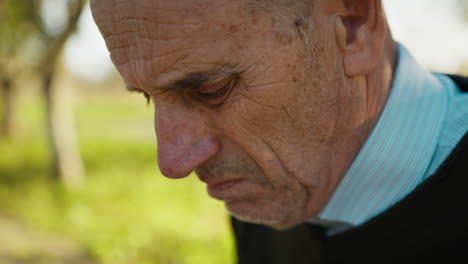 elderly man worried and sad about something he discovered