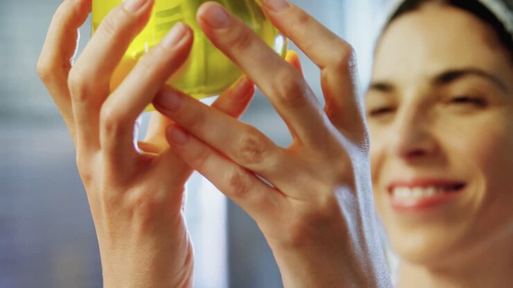 Technician examining olive oil