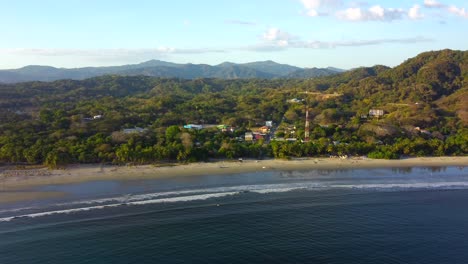 Aerial-over-Samara-Beach-and-town-in-the-Guanacaste-Province,-Costa-Rica