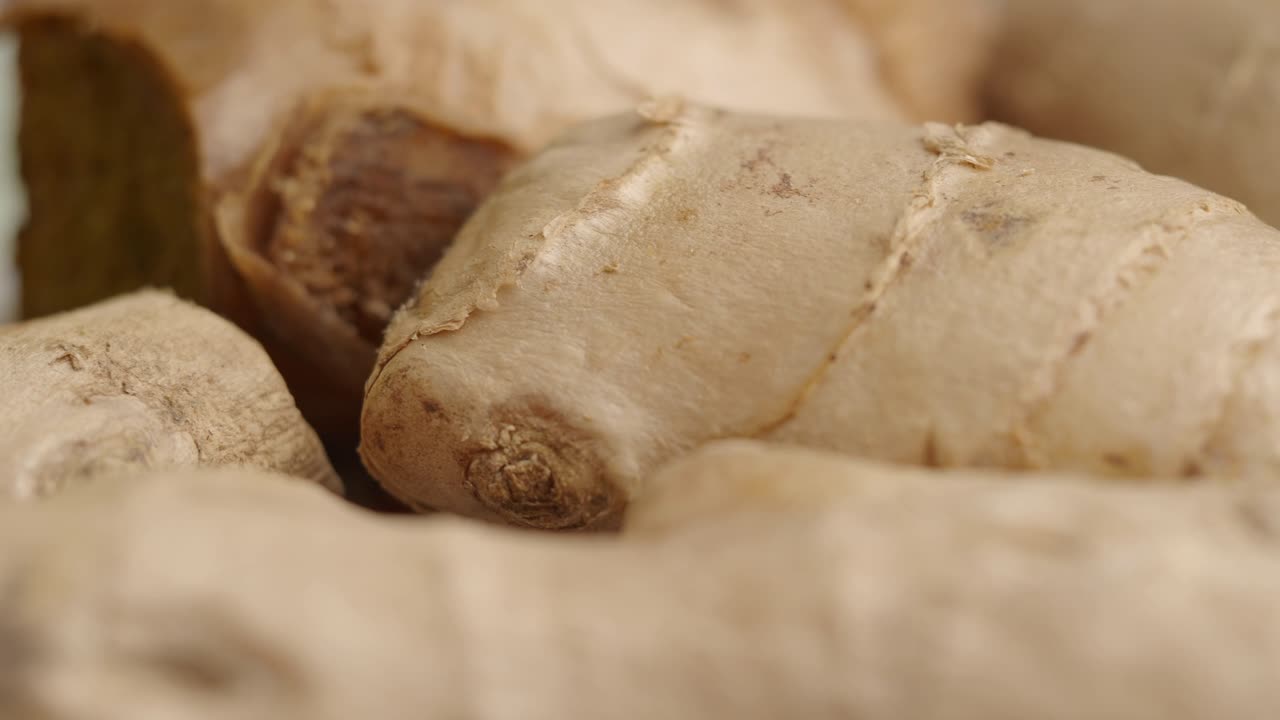 Close-up of Fresh Ginger Roots and Ginger Drink