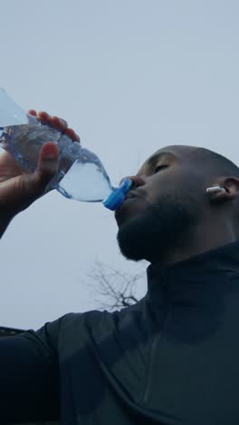 man drinking water