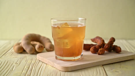 delicious sweet drink tamarind juice and ice cube - healthy drink style