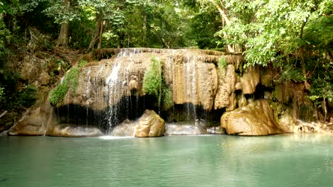 4k loop. erawan waterfall , popular famous tourist attraction in kanchanaburi, thailand. erawan waterfall is a waterfall in the tropical rain forest, popular with both thai and foreign tourists.