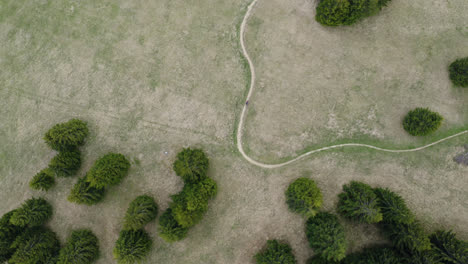 Aerial-View-Following-A-Man-Biking-Around-Malino-Brdo-Resort-In-Liptov,-Ruzomberok,-Slovakia