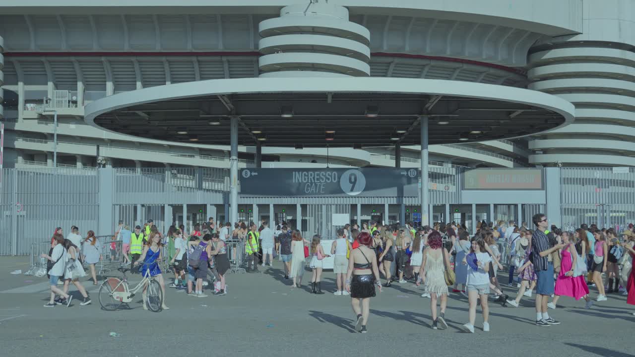 Large Crowd Entering a Stadium Gate