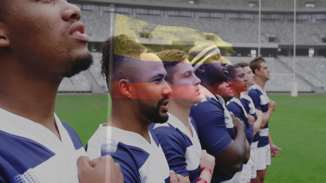 Standing in stadium, rugby players with hands on hearts, animation in background