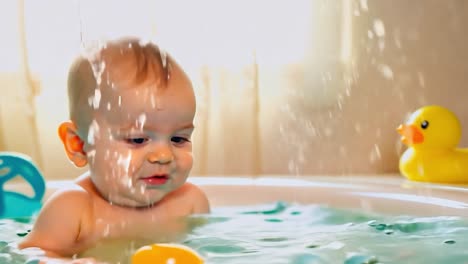 cute baby playing in the bath tub with toys