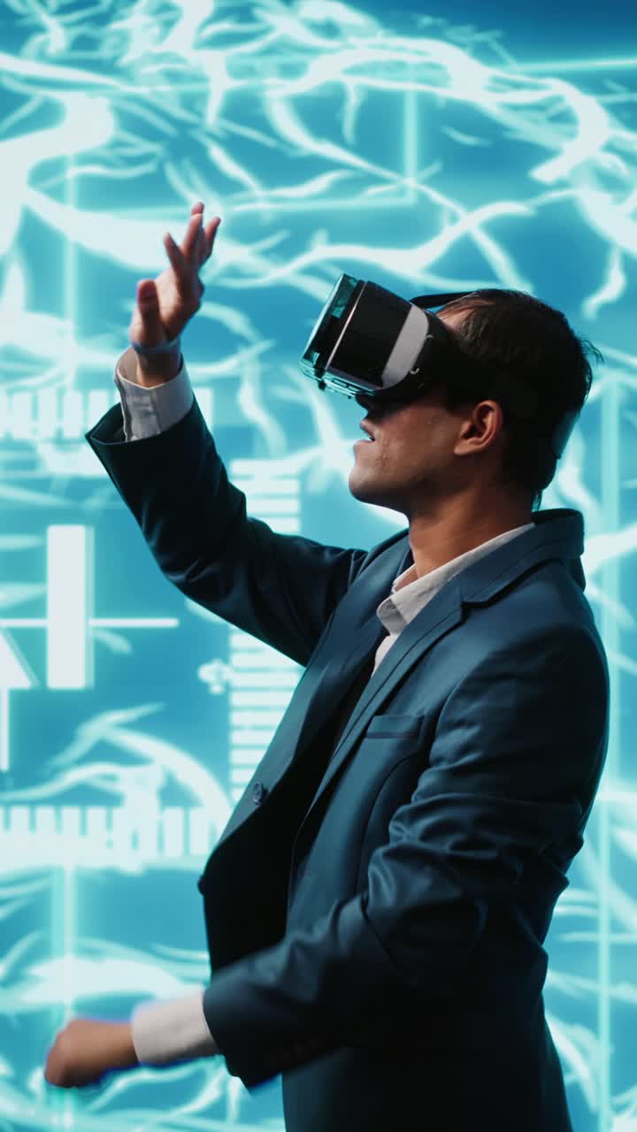 Vertical video System administrator wearing VR headset looking at hologram