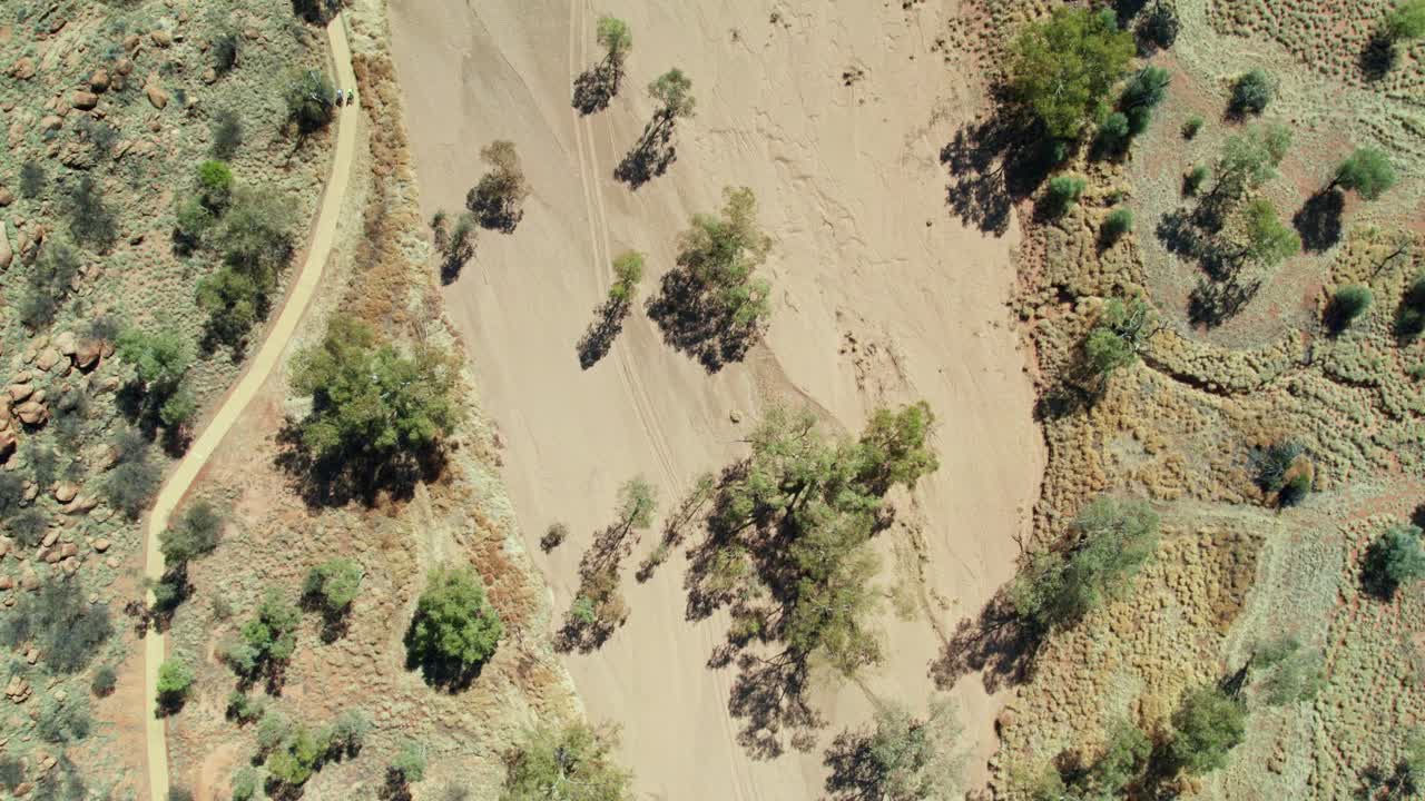 Drone view looking down on the dry river bed of the Todd River, north of Alice Springs, Mparntwe, Northern Territory, Australia. August 2022.