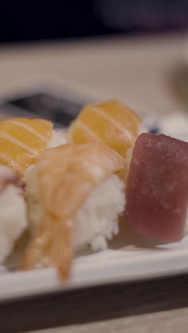 assorted sushi with chopsticks