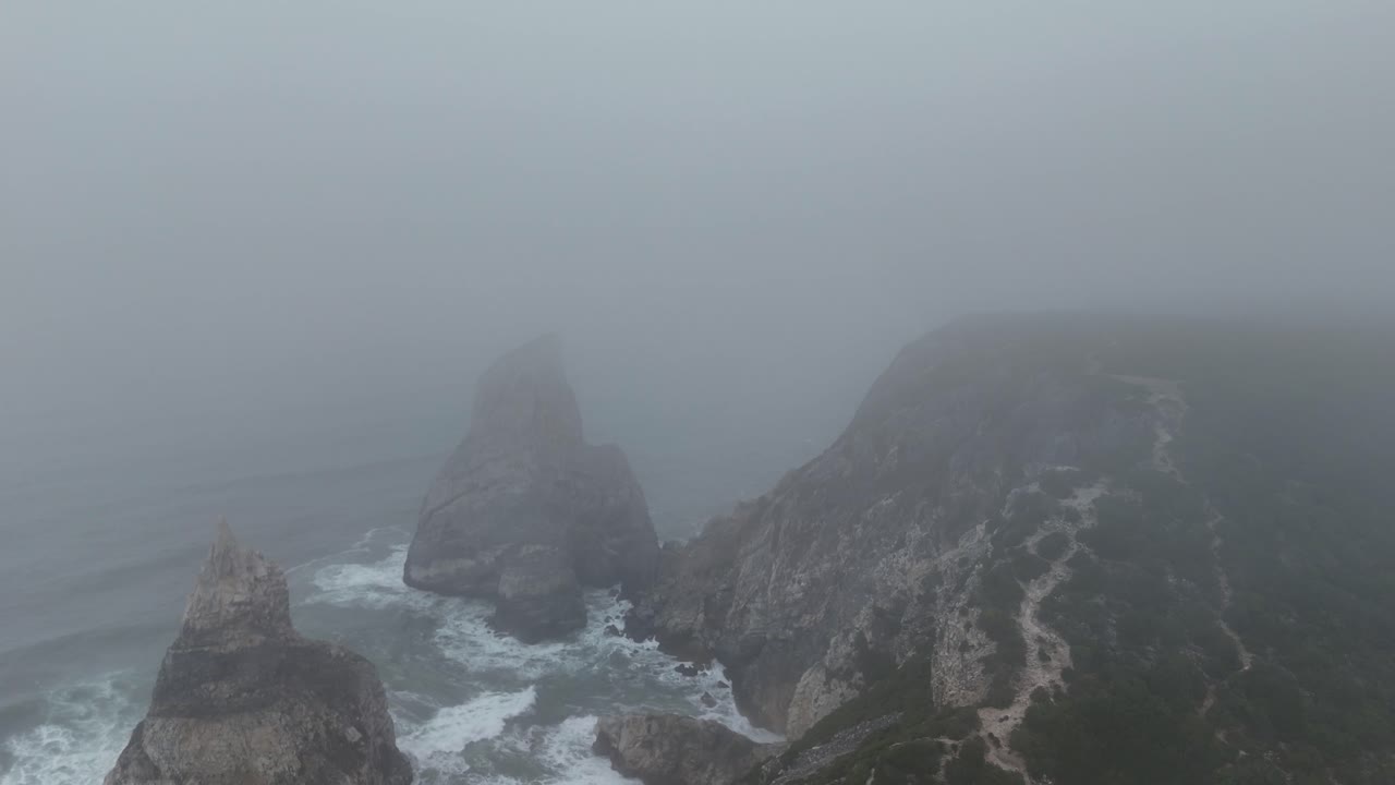Misty Coastal Landscape with Cliffs and Rocks