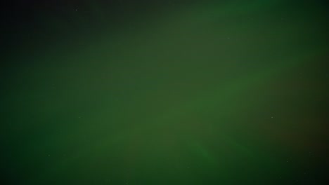 time lapse of the aurora borealis corona dancing in the night sky, exploding vibrant colours in the sky.