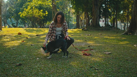 woman and dog in park
