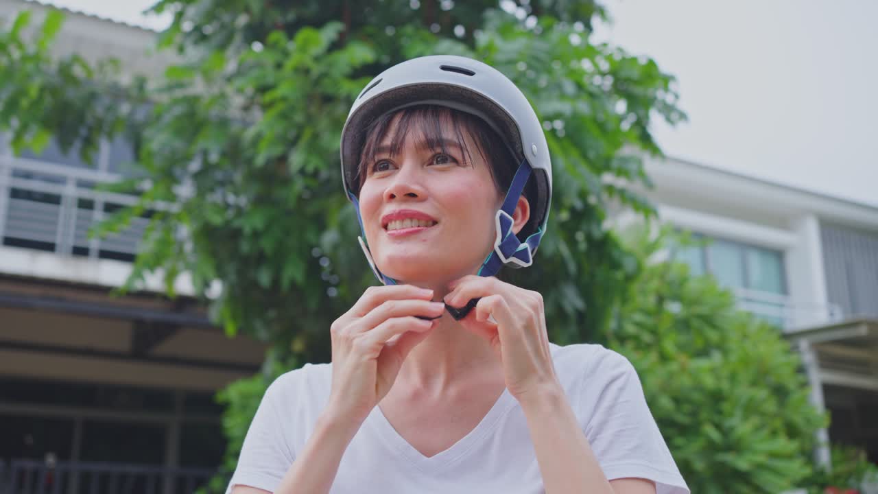 Woman Adjusting Bike Helmet