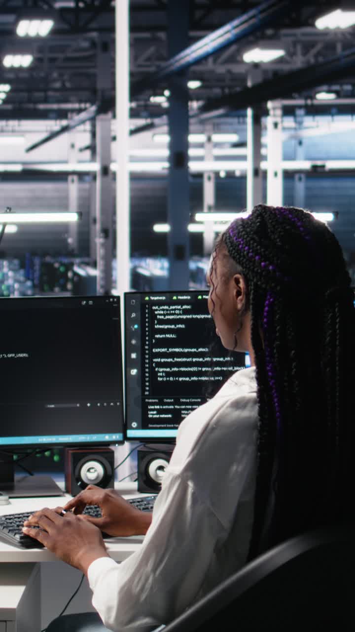 Vertical video Data center female programmer uses machine learning algorithms to analyze datasets