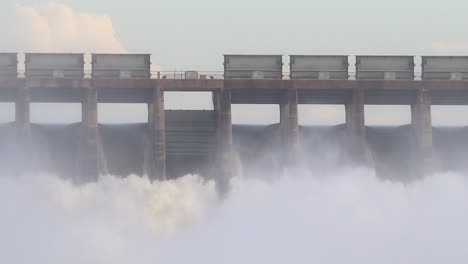 Closeup-of-floodgates-open-on-a-dam-wall,-Vaaldam-South-Africa,-Flooding