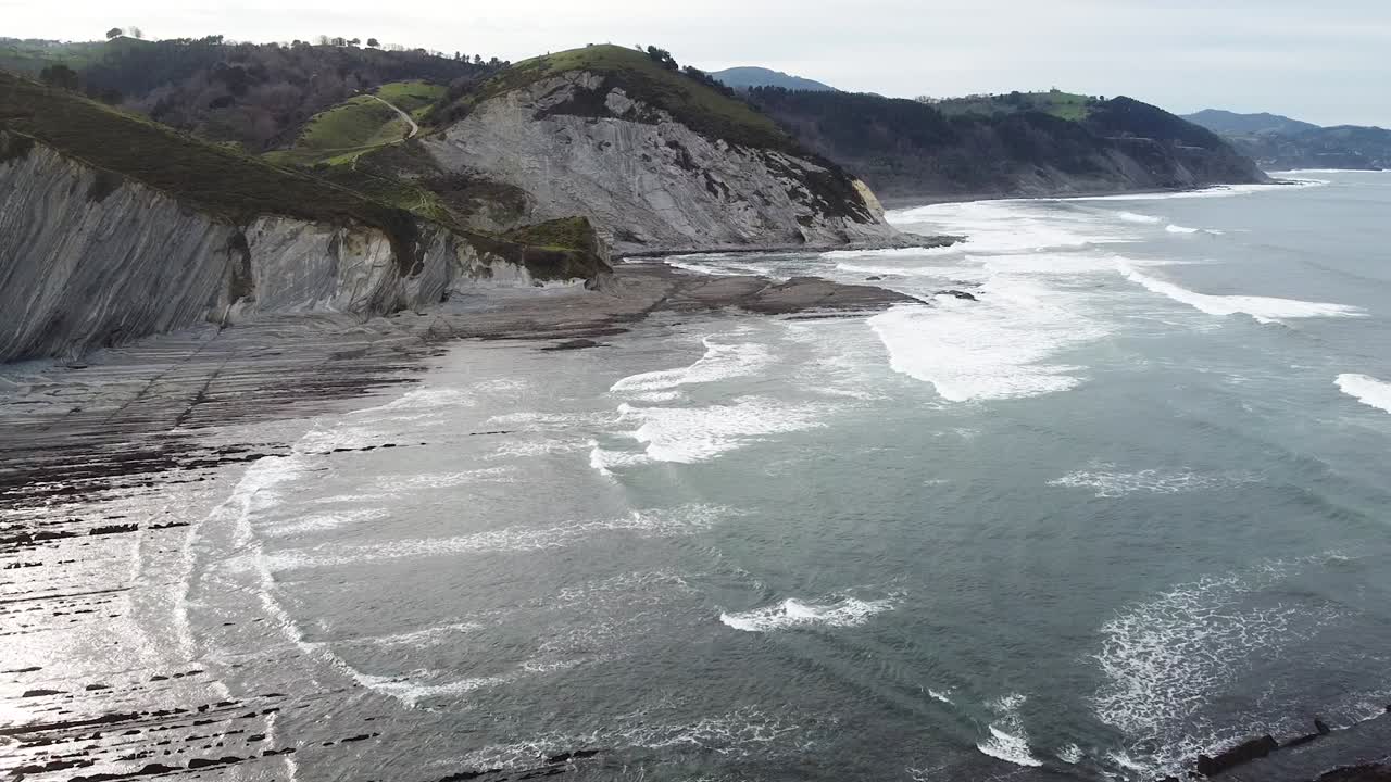 Aerial drone view of the coast flysch structure in the beach of Sakoneta in the Basque Country