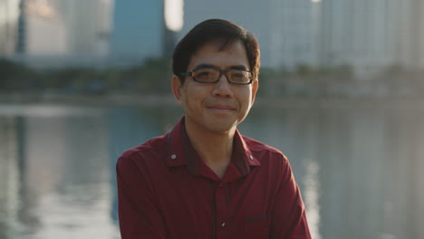 portrait of a man in a city park