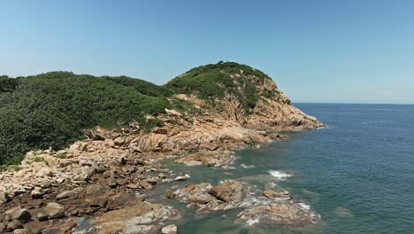 4K-Aerial-view-of-the-Hong-Kong-Geopark-in-Shek-O,-Crocodile-like-mountain