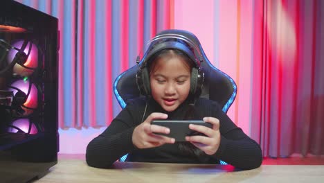 young gamer playing mobile game
