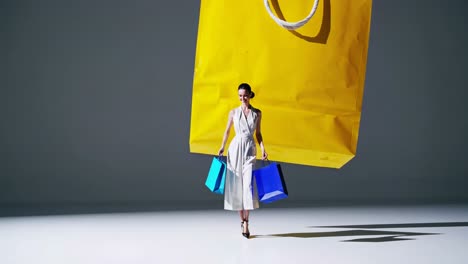 woman shopping with large yellow bags