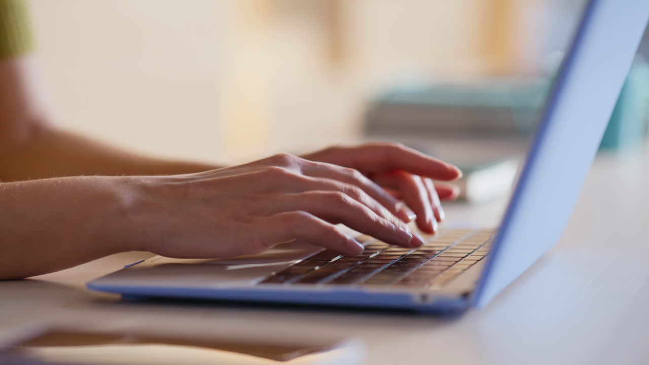 Typing on a laptop