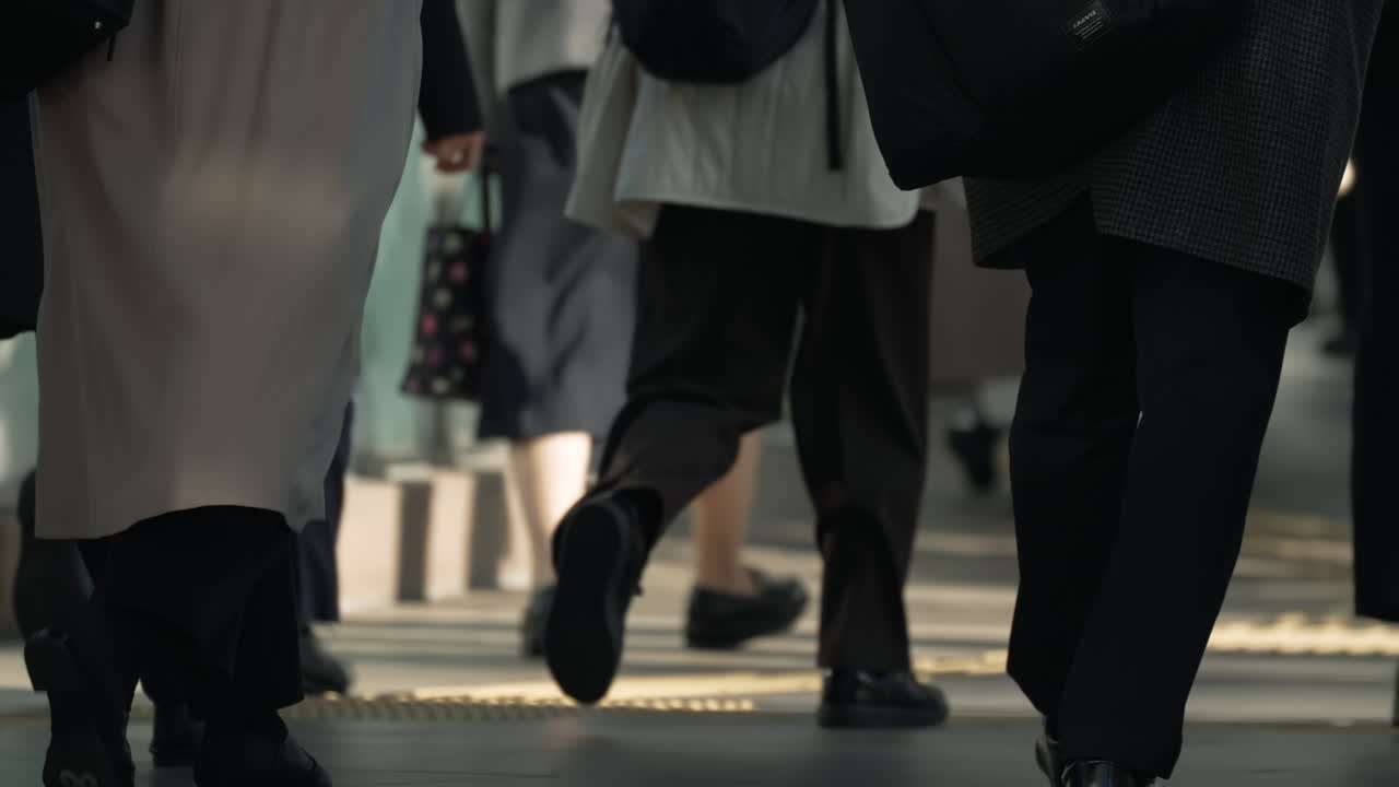 Busy commuters walking in a modern urban district in Tokyo