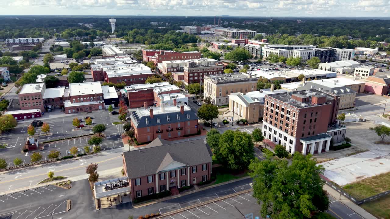 Aerial view of a city with various buildings and landmarks