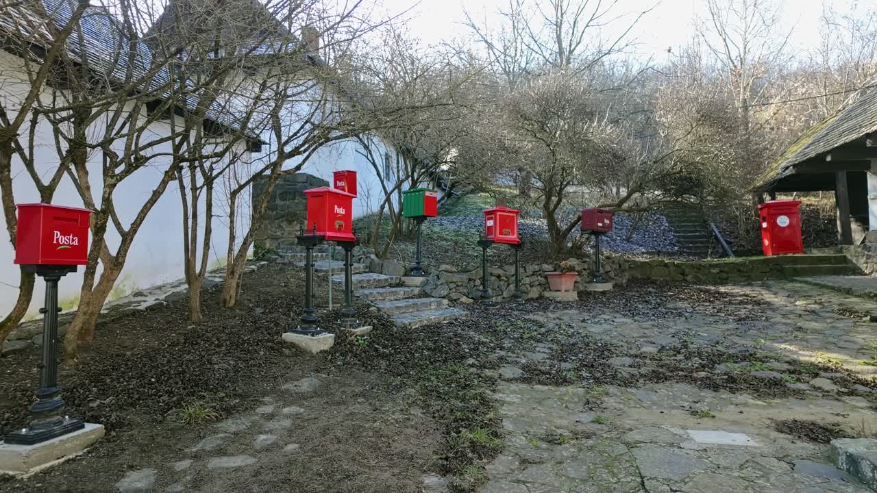 Static shot of post office mailboxes showing the development of mailboxes in Hungary in Holloko.