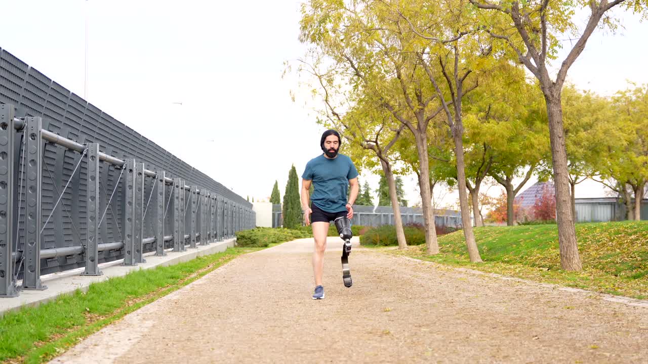 Man with Prosthetic Leg Running in Park