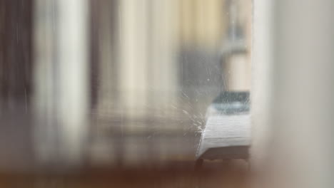 heavy rain falling on the facade windowsill