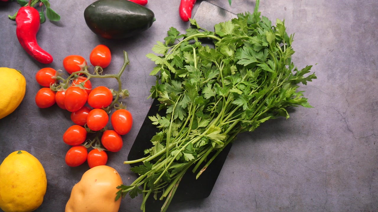Assortment of Fresh Vegetables and Fruits on a Dark Grey Surface