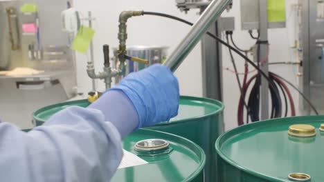 4k emptying nutraceutical oils out of large barrels or drums to be used to manufacture omega oil vitamins