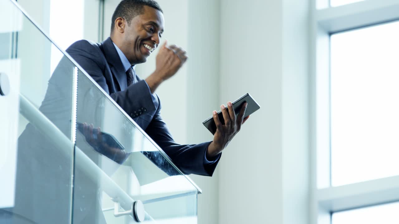 Male African American business manager using touchscreen technology