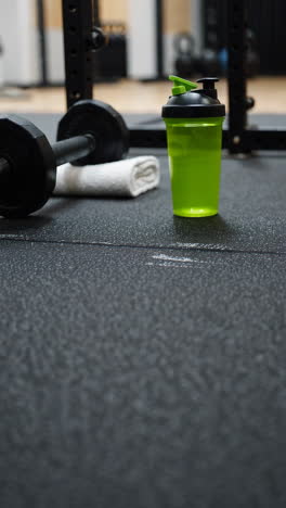gym equipment and protein shake
