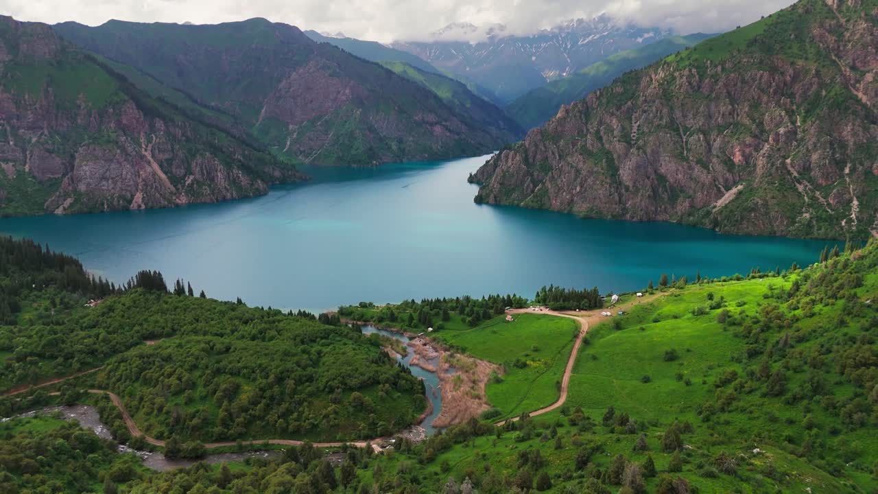 cinematic aerial view of sary chelek lake in Kyrgyzstan