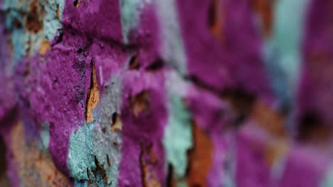 purple and blue green chipped paint background, focus pull