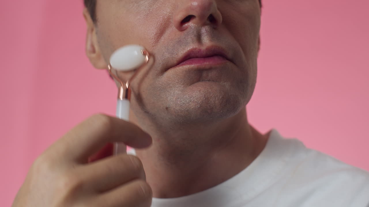 Man Practicing Anti-wrinkle Massage with Jade Roller