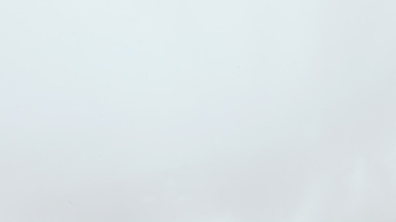 Closeup avocado slices water floating in super slow motion. Organic nutrition.