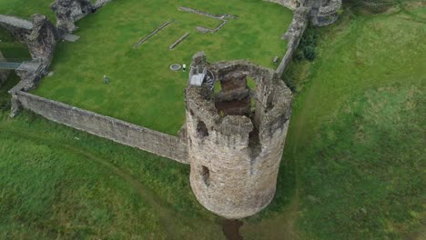 flint castle welsh medieval coastal military fortress ruin aerial view rising birdseye over turret