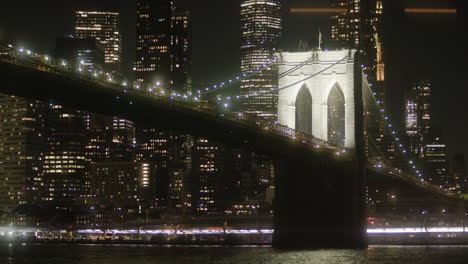 brooklyn bridge at night, skyline of new york, nyc citylights, angled view
