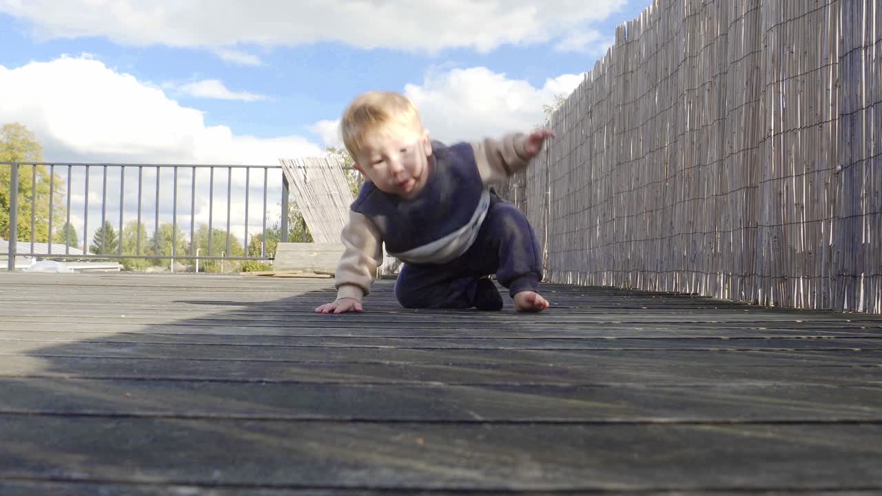 Adorable Baby Crawling on Deck