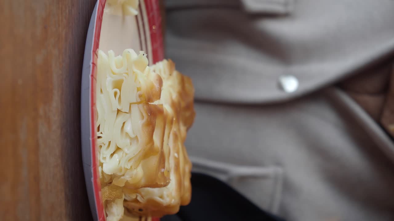 Woman Eating a Turkish Pastry