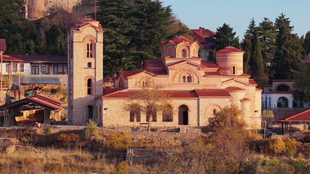Aerial drone view of the restored St. Clement and Panteleimon Church at Plaosnik, showcasing its Byzantine architecture surrounded by historical ruins. Ohrid, North Macedonia